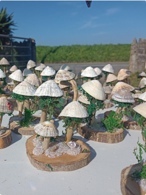 Mushroom ornaments made from seashells and driftwood.